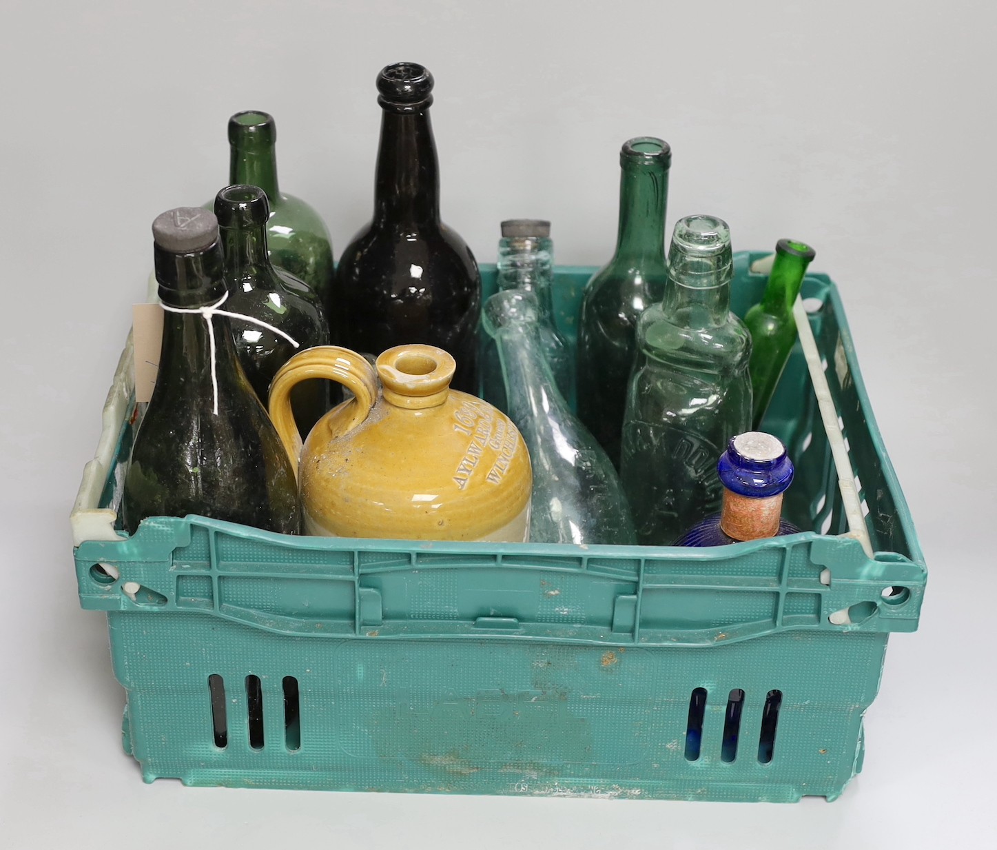 A Hardens 'Hand Grenade' fire extinguisher, an 18th century apothecary's bottle and various small coloured glass potion and ink bottles together with a collection of old wine and mineral water bottles